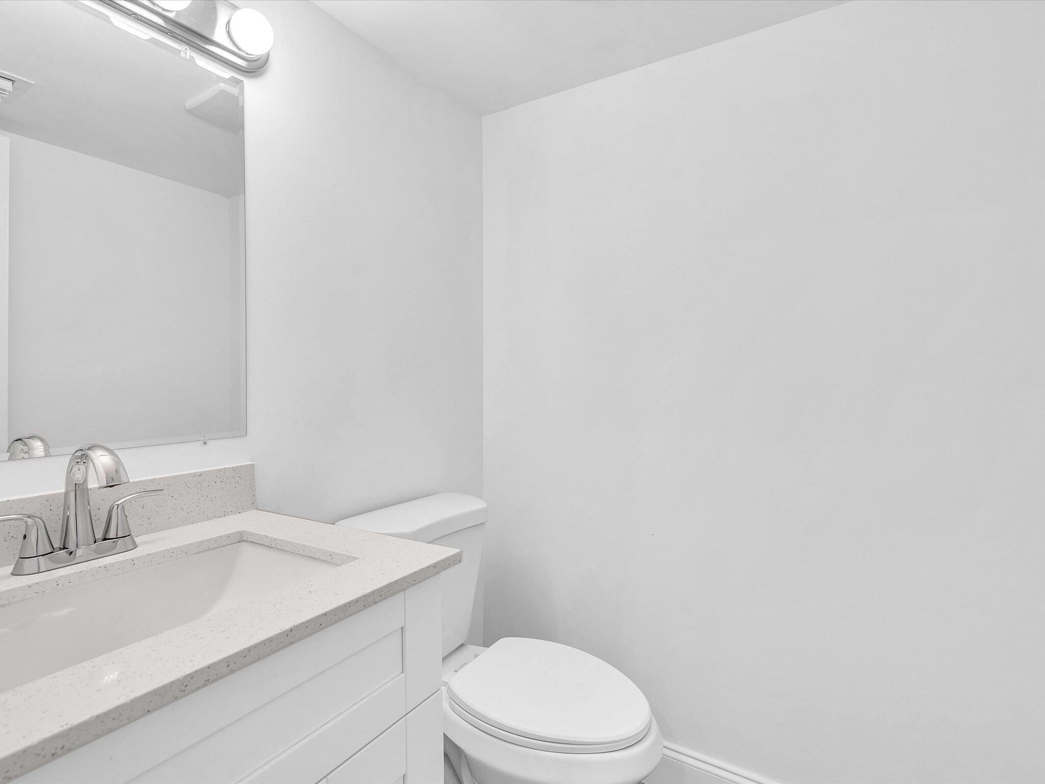 3841 Farragut Street Hollywood, FL 33021 - Photo 37 of 47 a bathroom with a sink a toilet and vanity