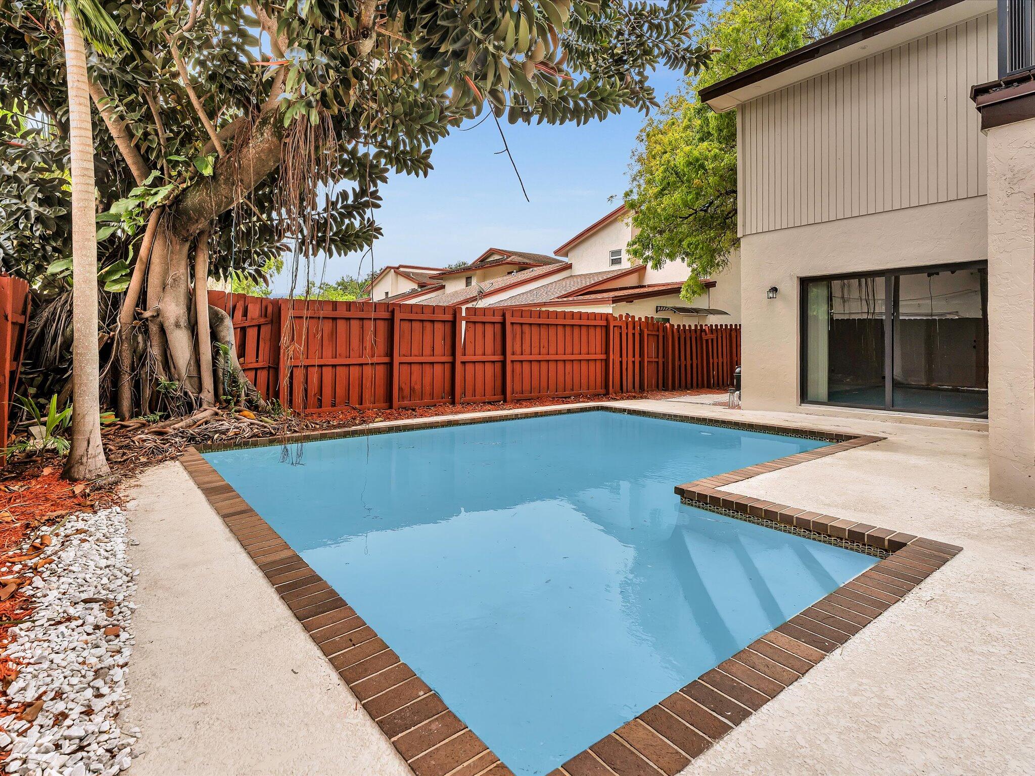 3841 Farragut Street Hollywood, FL 33021 - Photo 40 of 47 a view of a backyard with a barbeque