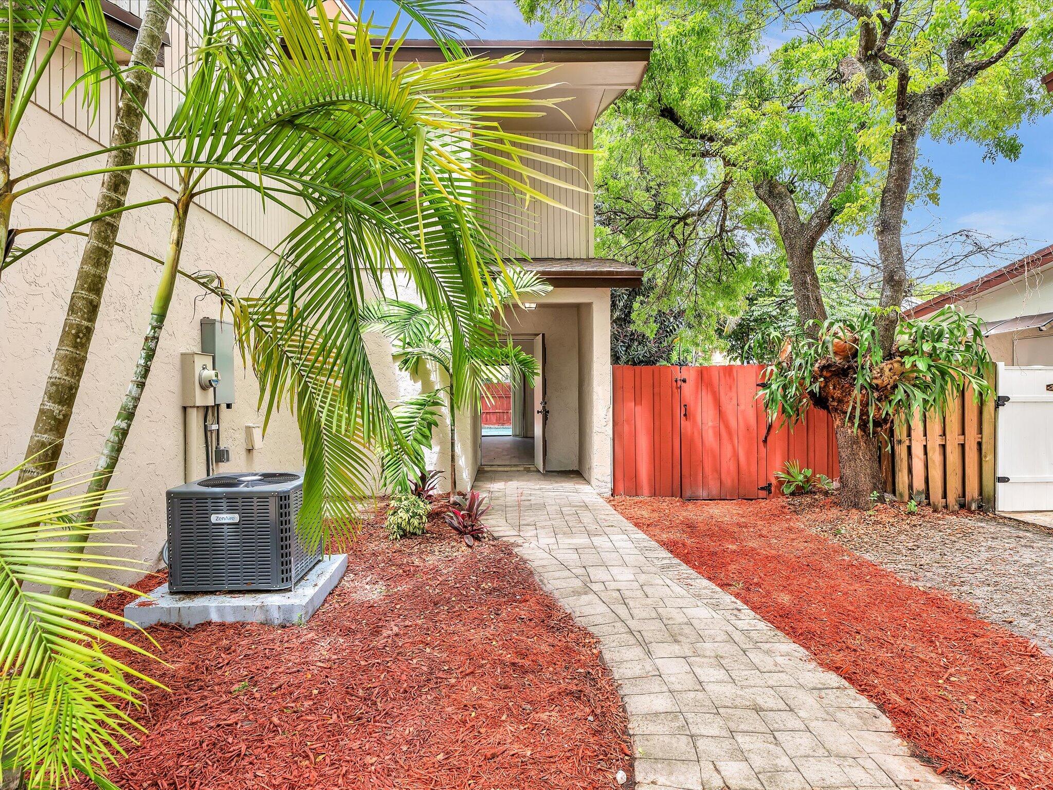 3841 Farragut Street Hollywood, FL 33021 - Photo 47 of 47 a front view of a house with a yard and trees