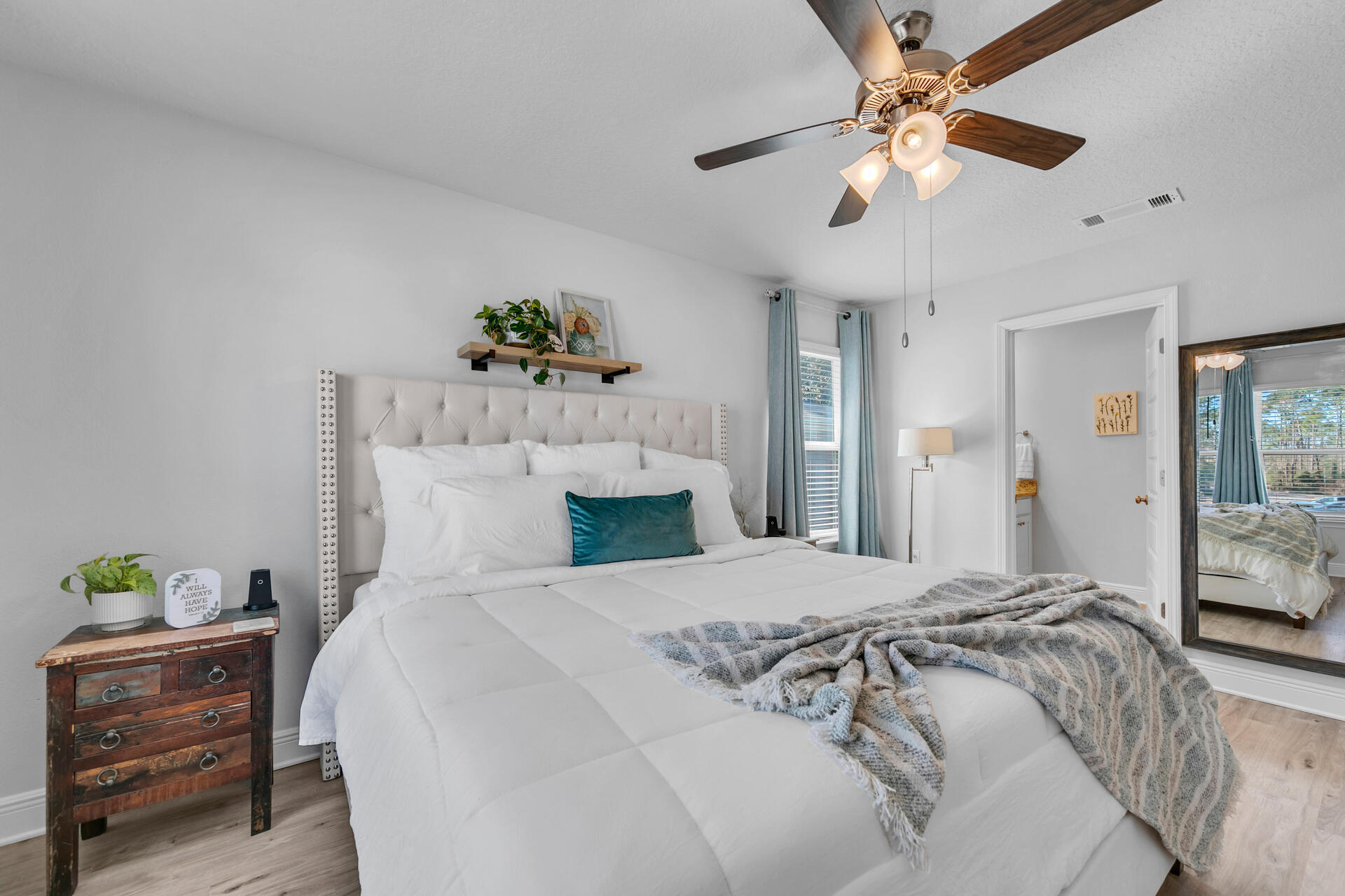 12 Sandy Cv Way, Unit LOT 104 Miramar Beach, FL 32550 - Photo 18 of 32 a spacious bedroom with a bed and a chandelier