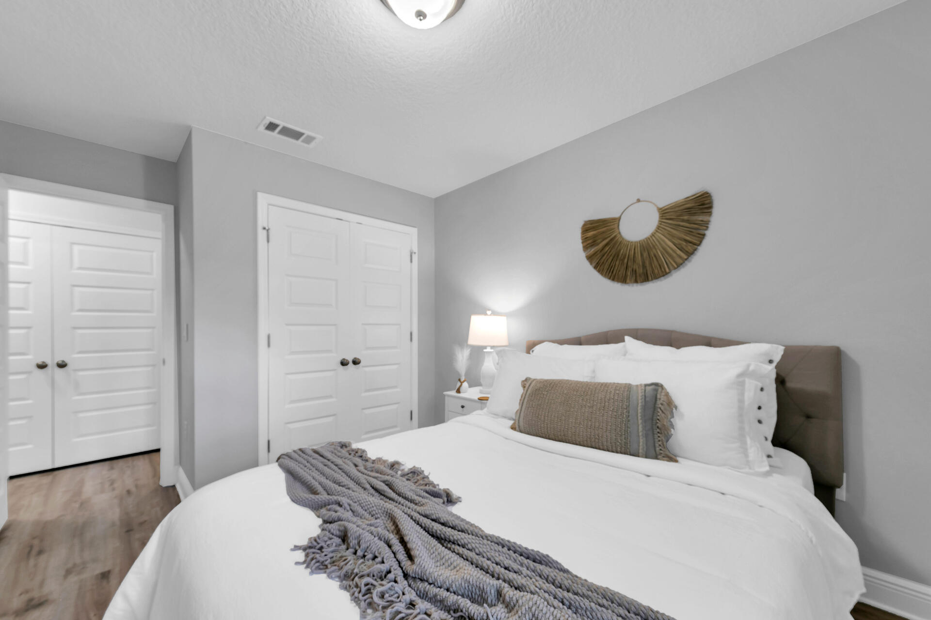 12 Sandy Cv Way, Unit LOT 104 Miramar Beach, FL 32550 - Photo 26 of 32 a bedroom with a bed and a chandelier