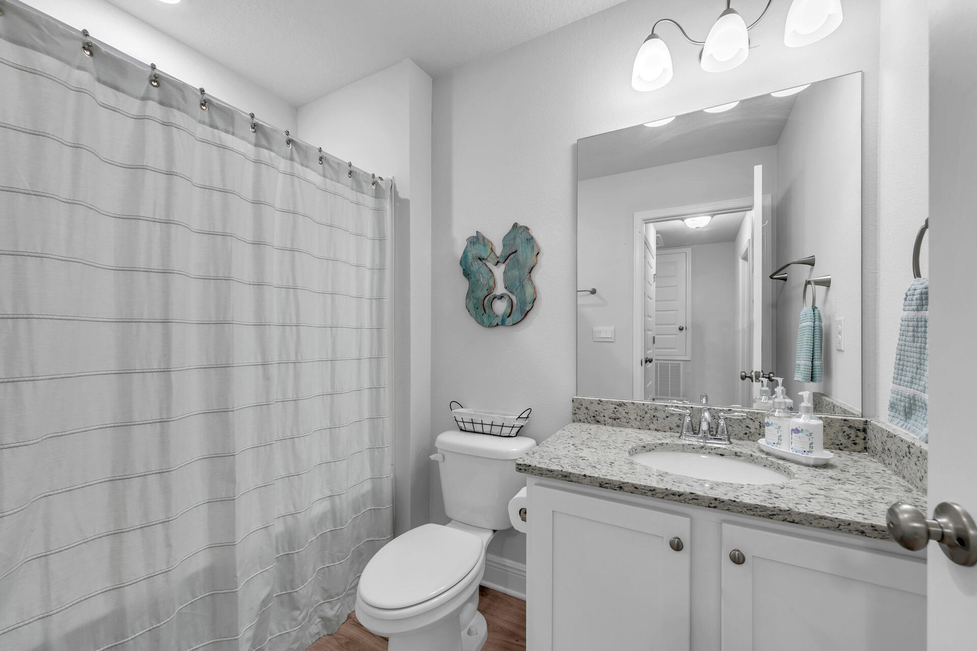 12 Sandy Cv Way, Unit LOT 104 Miramar Beach, FL 32550 - Photo 28 of 32 a bathroom with a granite countertop sink a toilet and a mirror