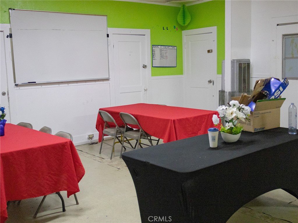 203 West 20th Street Merced, CA 95340 - Photo 6 of 10 a bedroom with a bed and a table