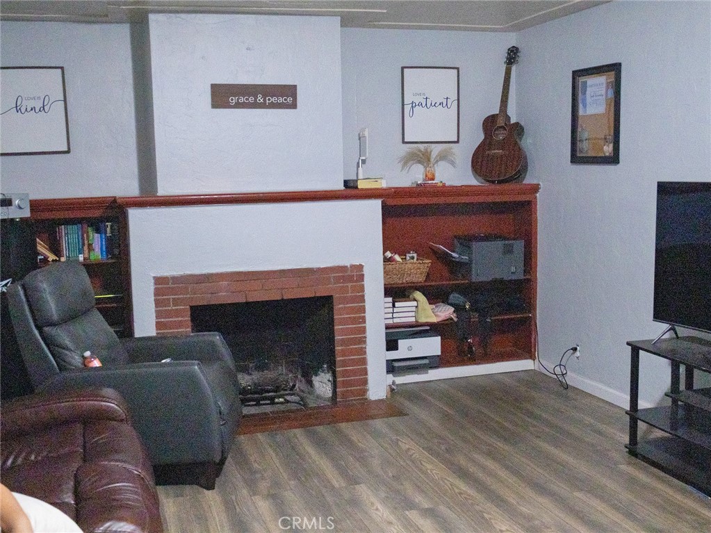203 West 20th Street Merced, CA 95340 - Photo 10 of 10 a living room with furniture and a fireplace