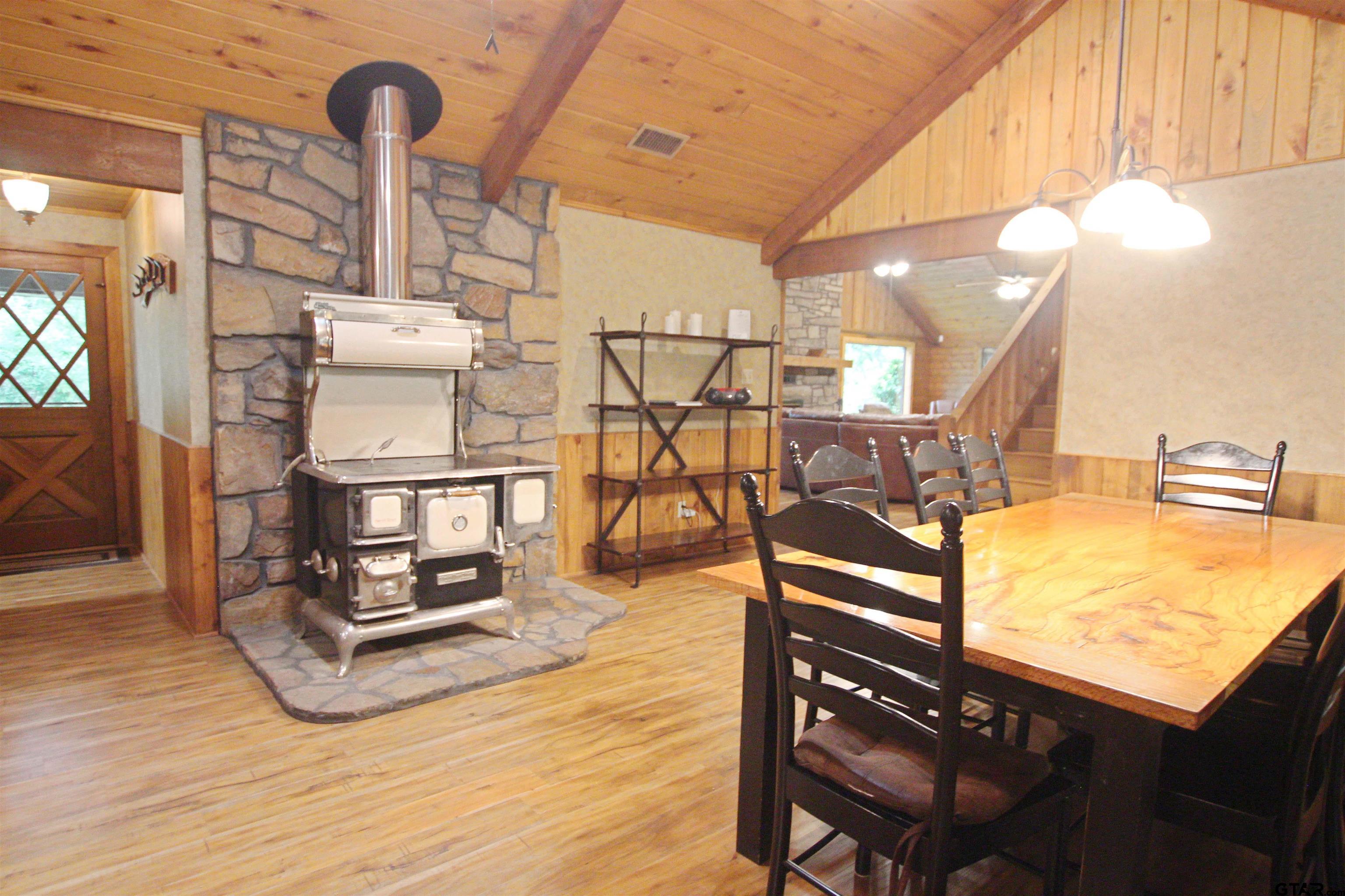 782 Rosie Wady Road Gladewater, TX 75647 - Photo 8 of 48 a view of a room with wooden floor and windows
