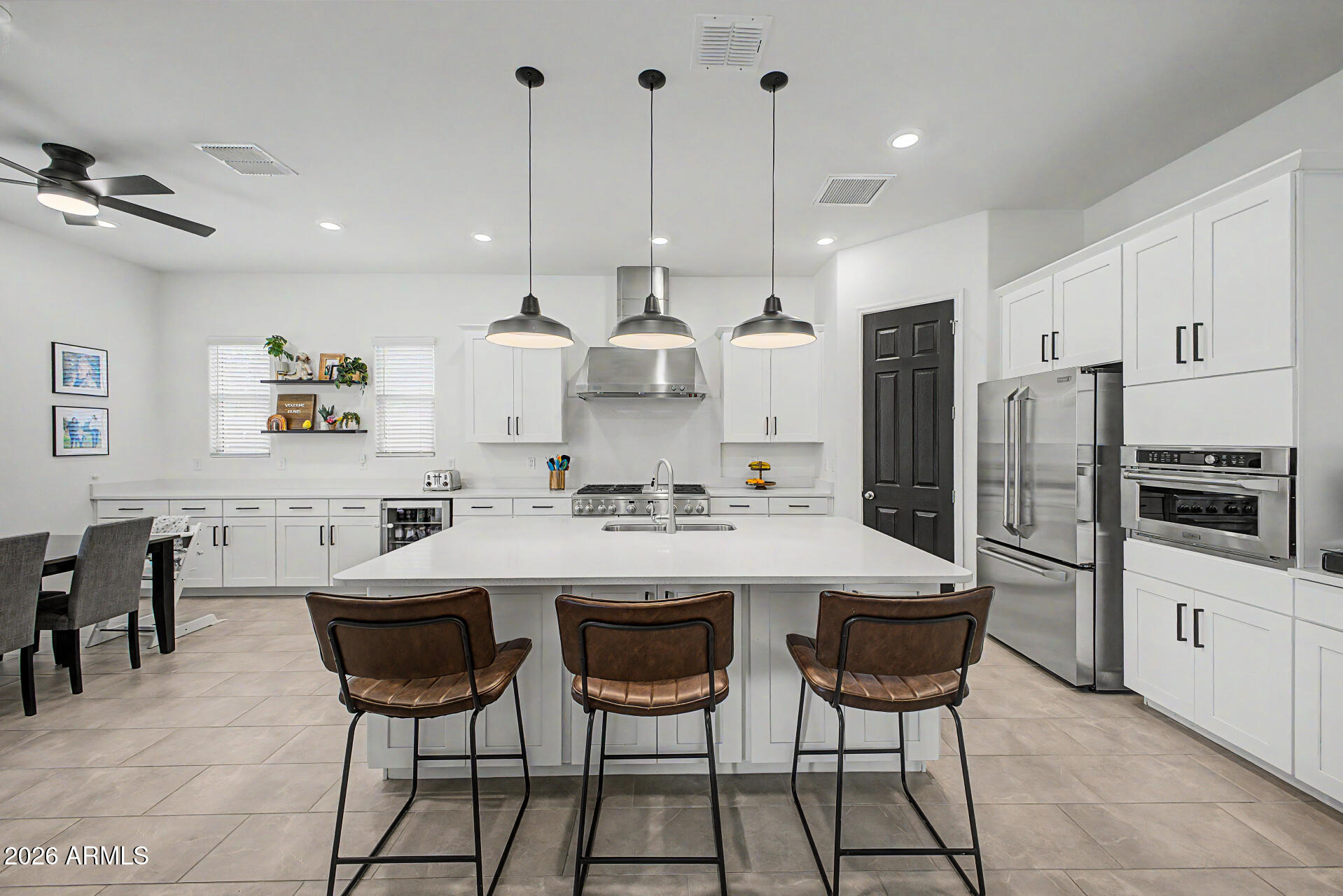 6511 West Steed Ridge Phoenix, AZ 85083 - Photo 3 of 41 a large kitchen with a table and chairs