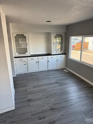 a backyard of a house with wooden fence