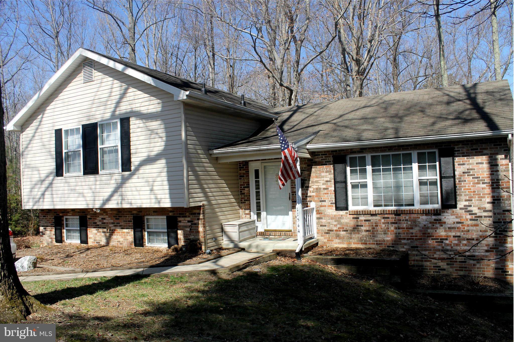 11544 Big Sandy Run Road Lusby, MD 20657 - Photo 1 of 12 a front view of a house with yard