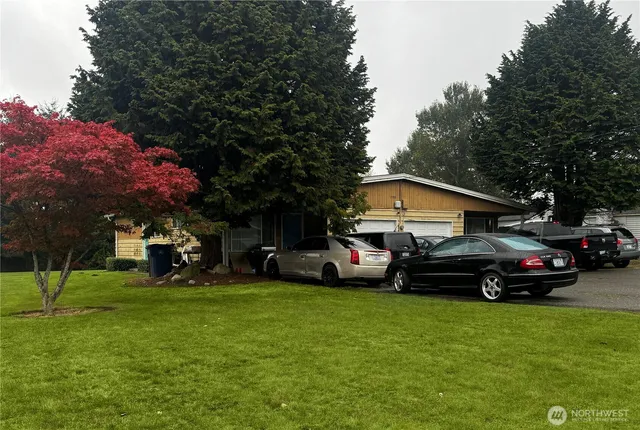 a front view of a house with garden