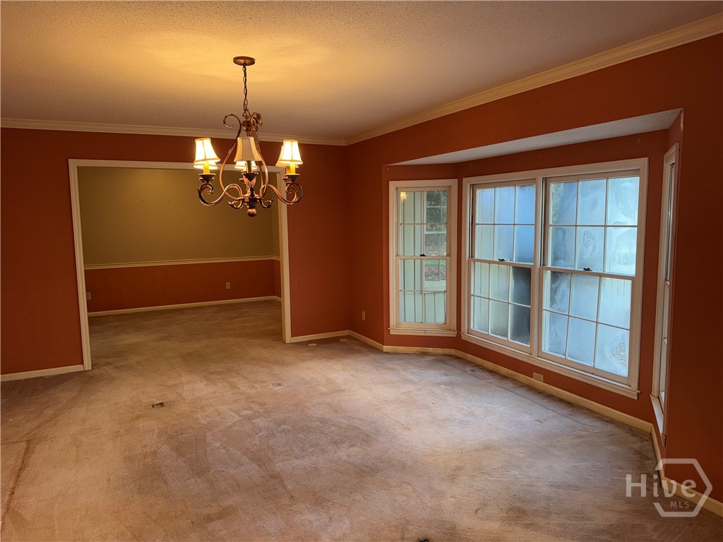 18 Monastery Road Savannah, GA 31411 - Photo 17 of 50 Living room opening to the dining room