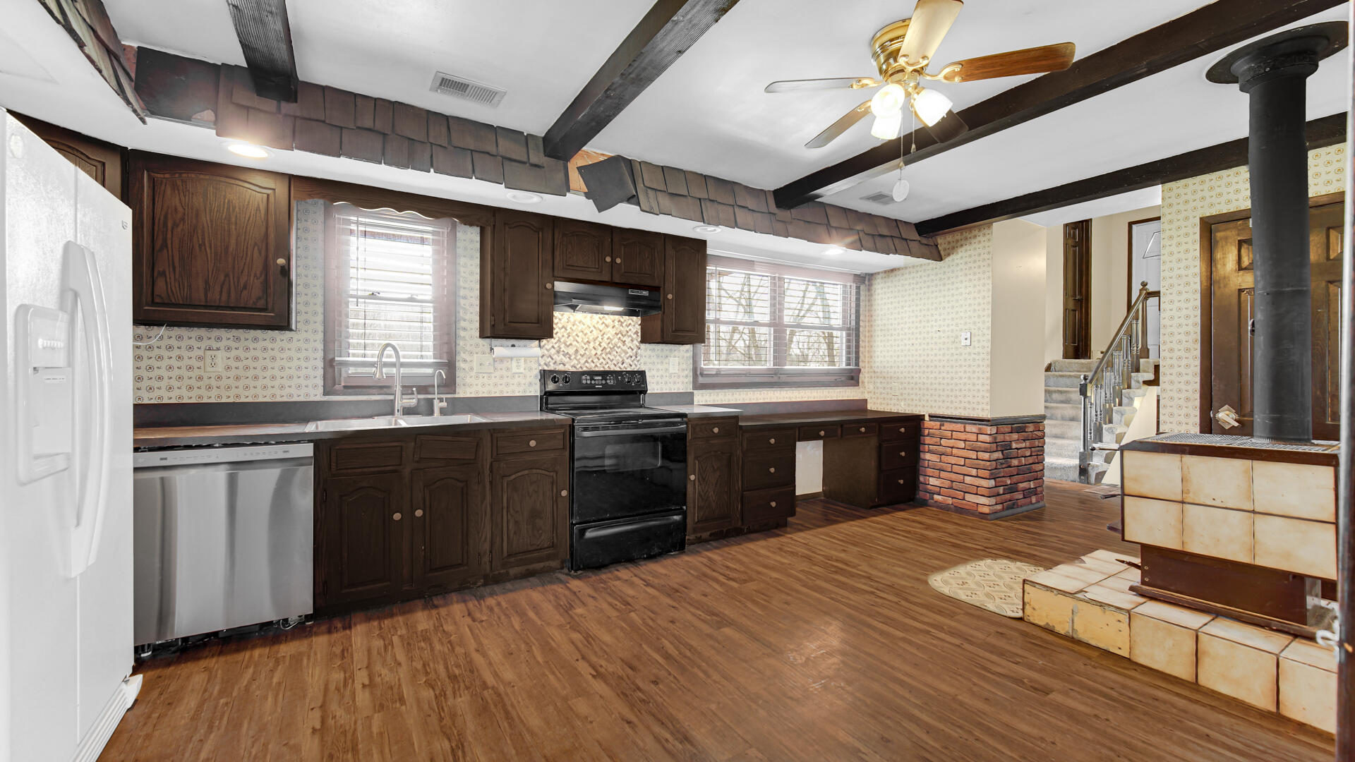 3050 East 139th Avenue Crown Point, IN 46307 - Photo 8 of 38 a kitchen with stainless steel appliances kitchen island granite countertop a sink cabinets and wooden floor