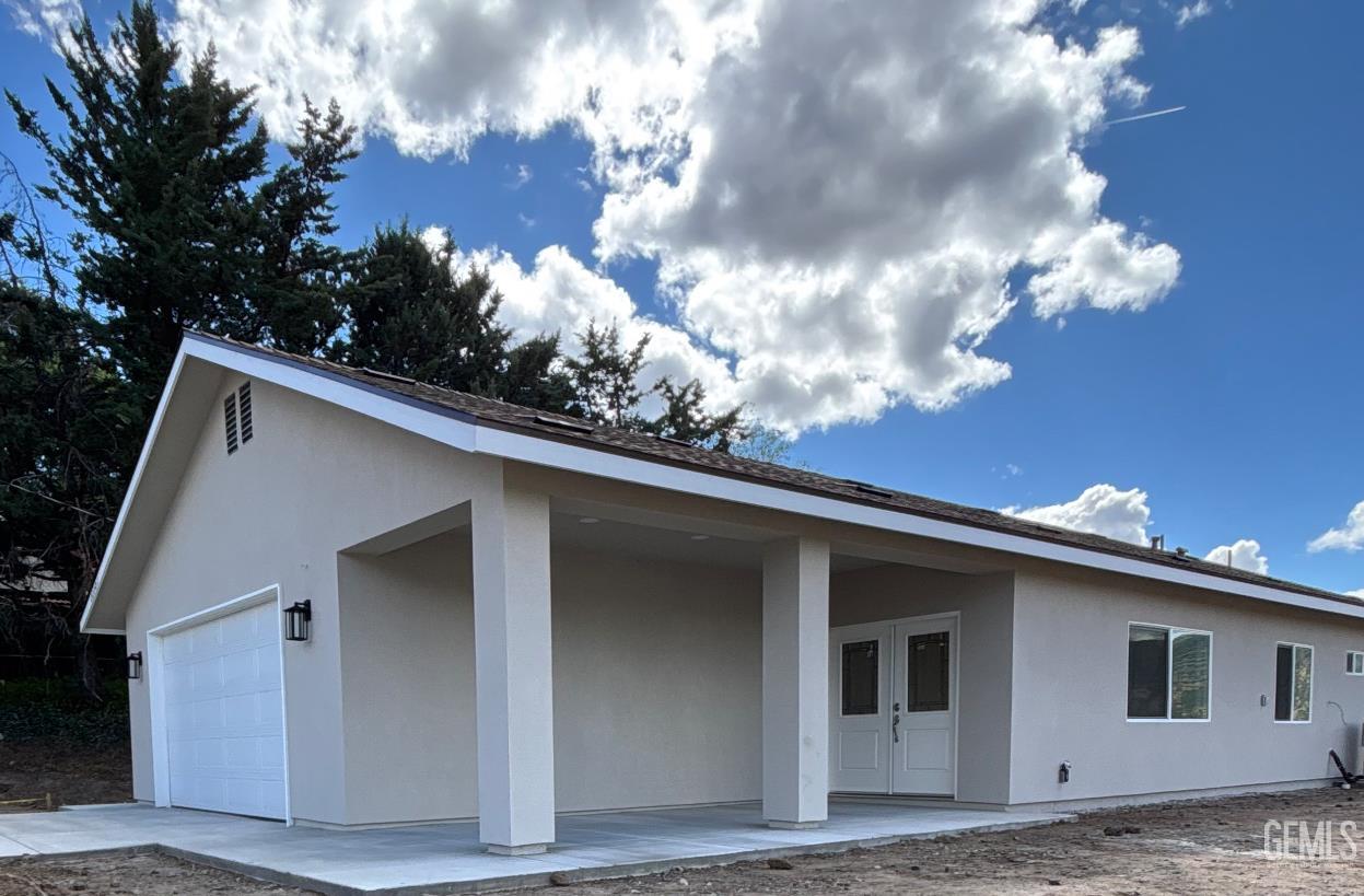 Undisclosed Address Tehachapi, CA 93561 - Photo 1 of 24 a view of a house with a backyard