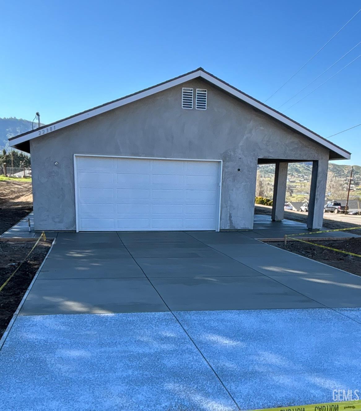 Undisclosed Address Tehachapi, CA 93561 - Photo 18 of 24 a front view of a house with a garage