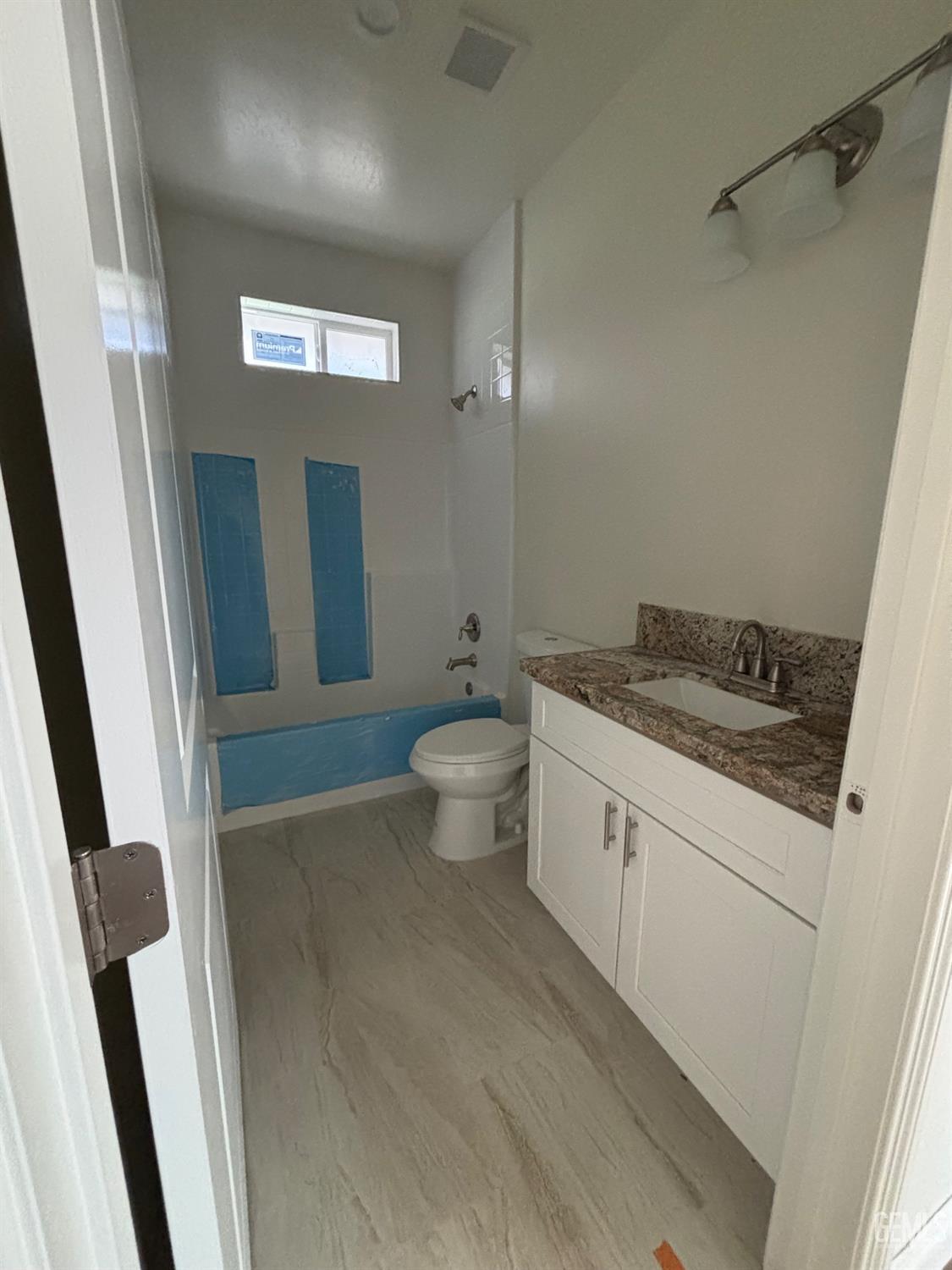 Undisclosed Address Tehachapi, CA 93561 - Photo 7 of 14 a spacious bathroom with a granite countertop sink toilet and shower