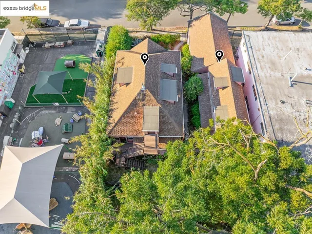 an aerial view of residential houses with outdoor space