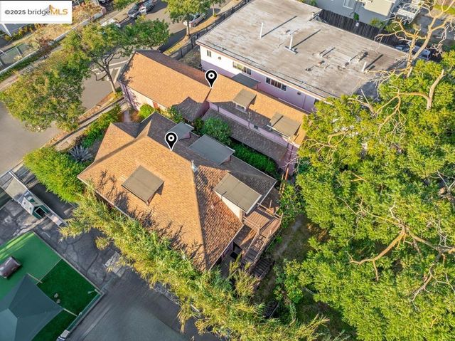 an aerial view of a house with a yard and garden