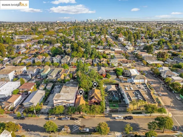an aerial view of residential building with green space