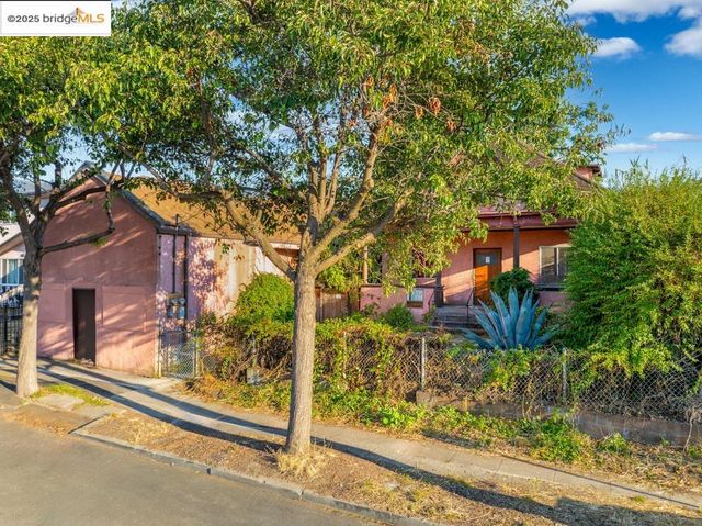 front view of a house with a tree