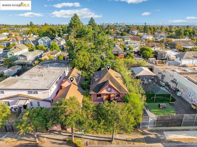 an aerial view of residential houses with outdoor space