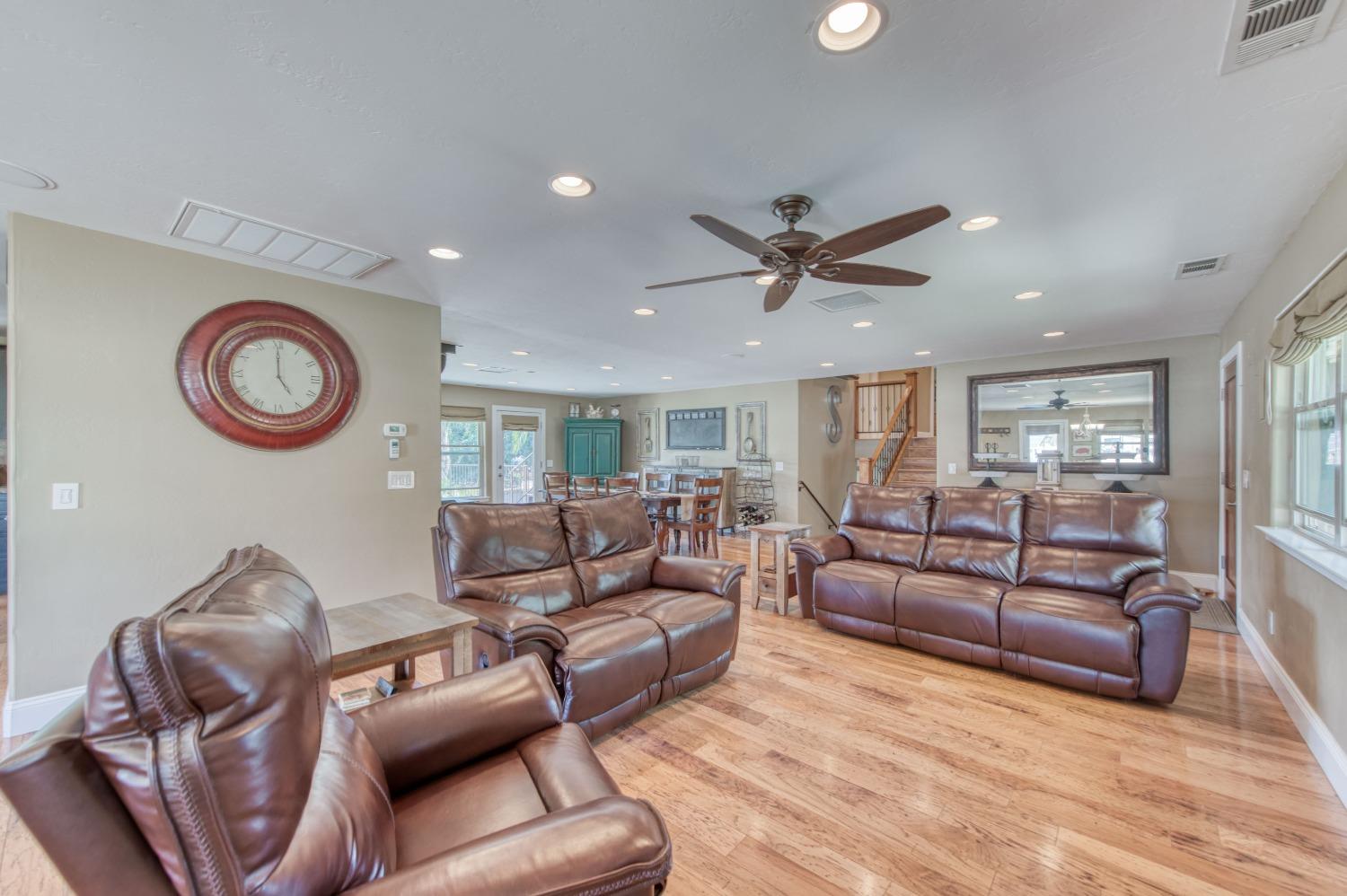 5588 North McCall Avenue Clovis, CA 93619 - Photo 13 of 77 a living room with furniture and a clock