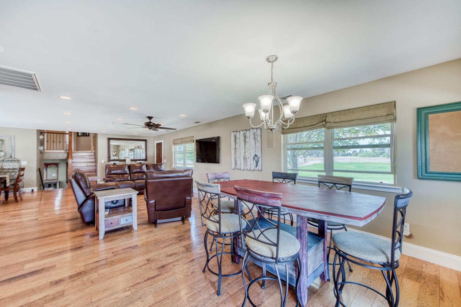 5588 North McCall Avenue Clovis, CA 93619 - Photo 16 of 77 a view of a dining room with furniture window and wooden floor