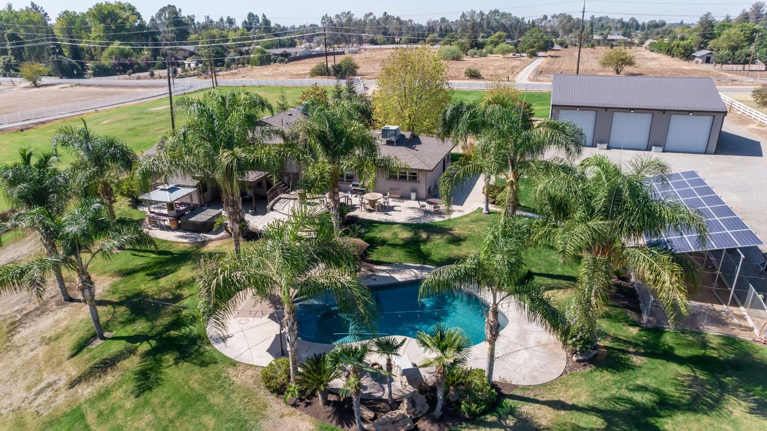 5588 North McCall Avenue Clovis, CA 93619 - Photo 2 of 77 a view of a lake with a building in the background