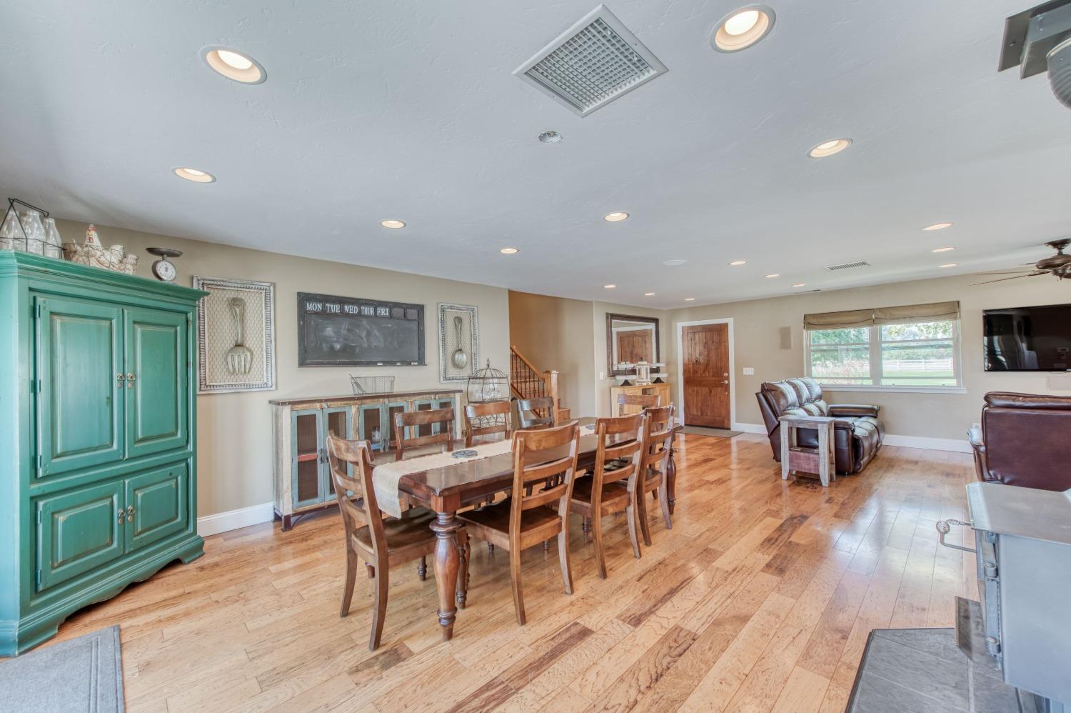 5588 North McCall Avenue Clovis, CA 93619 - Photo 26 of 77 a view of a dining room with furniture window and wooden floor