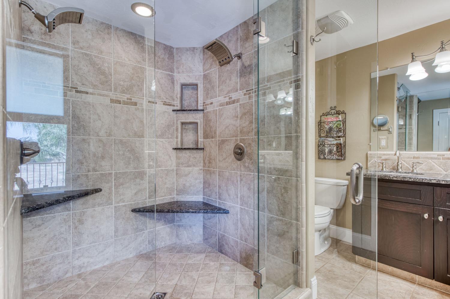 5588 North McCall Avenue Clovis, CA 93619 - Photo 33 of 77 a bathroom with a shower and a sink