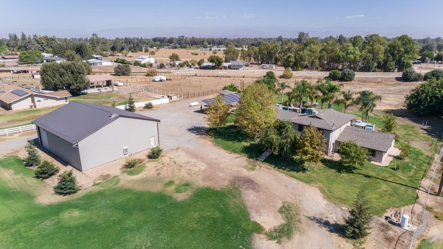 5588 North McCall Avenue Clovis, CA 93619 - Photo 4 of 77 an aerial view of residential houses with outdoor space and trees