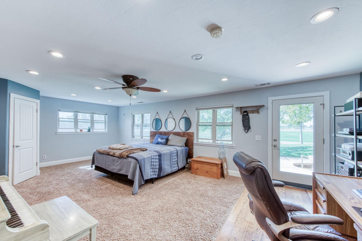 5588 North McCall Avenue Clovis, CA 93619 - Photo 45 of 77 a living room with furniture and a large window