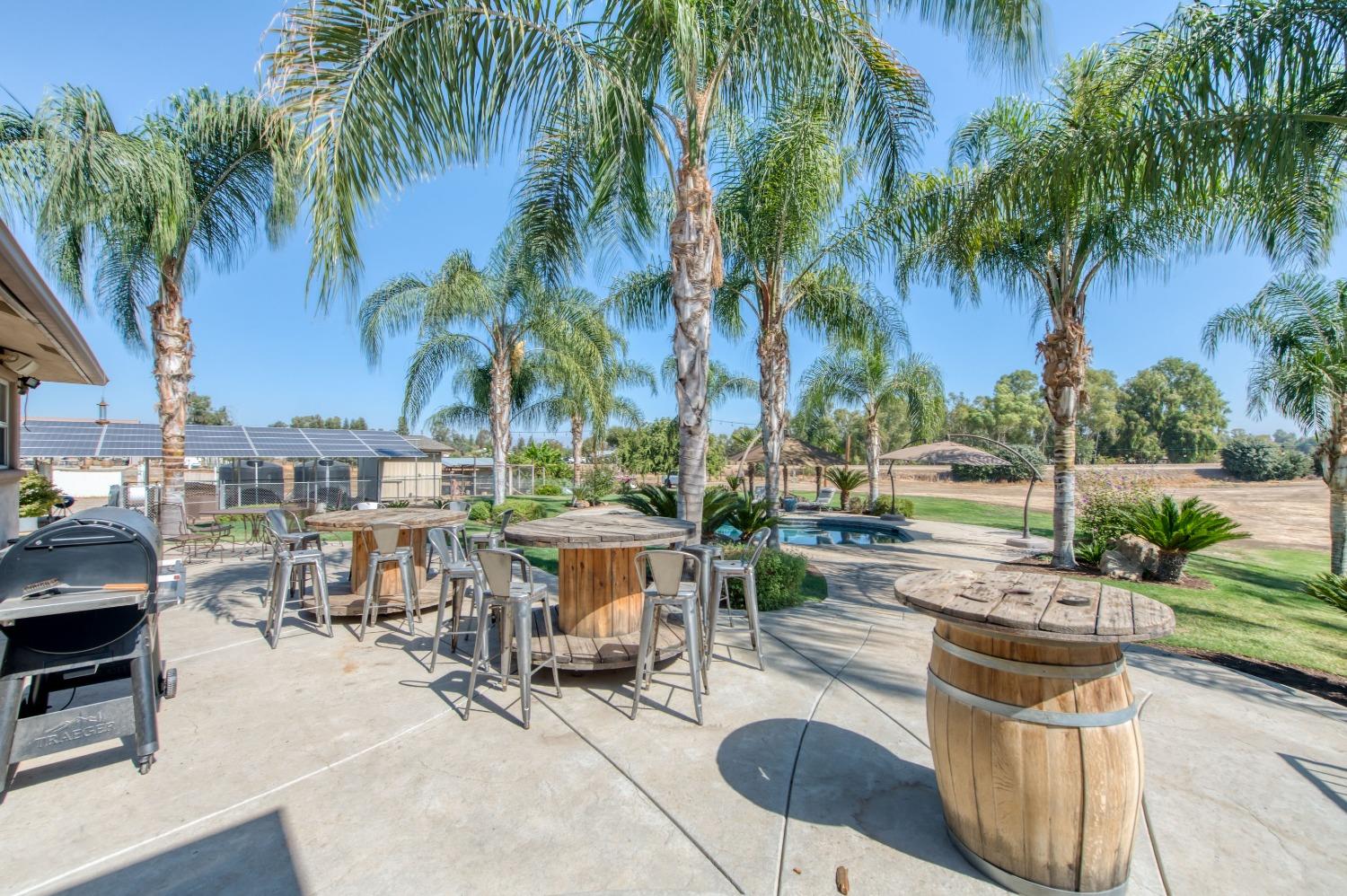 5588 North McCall Avenue Clovis, CA 93619 - Photo 49 of 77 a view of a swimming pool with chairs