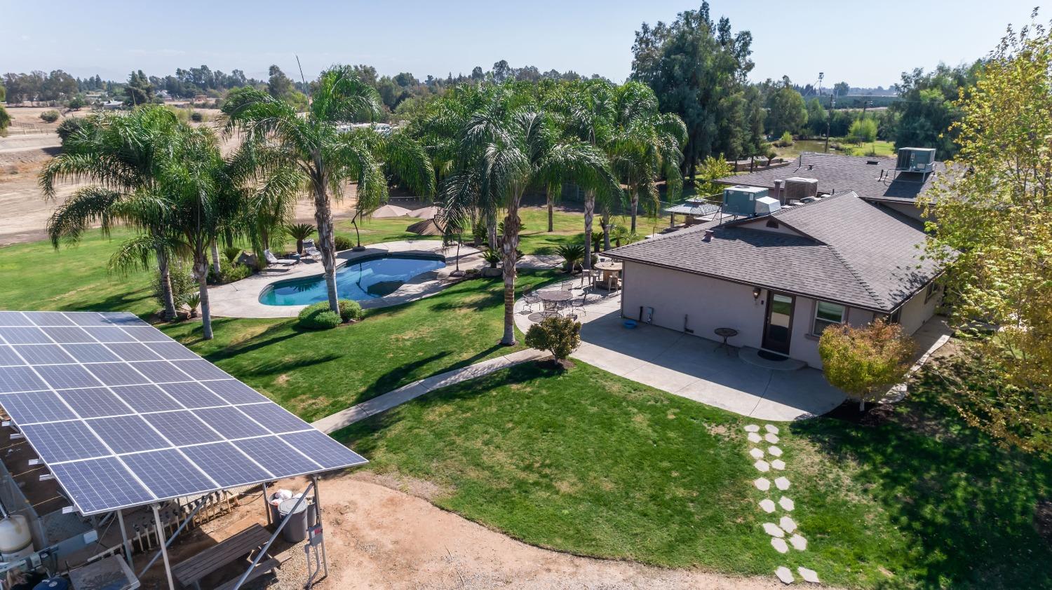 5588 North McCall Avenue Clovis, CA 93619 - Photo 5 of 77 an aerial view of a house with swimming pool garden and patio