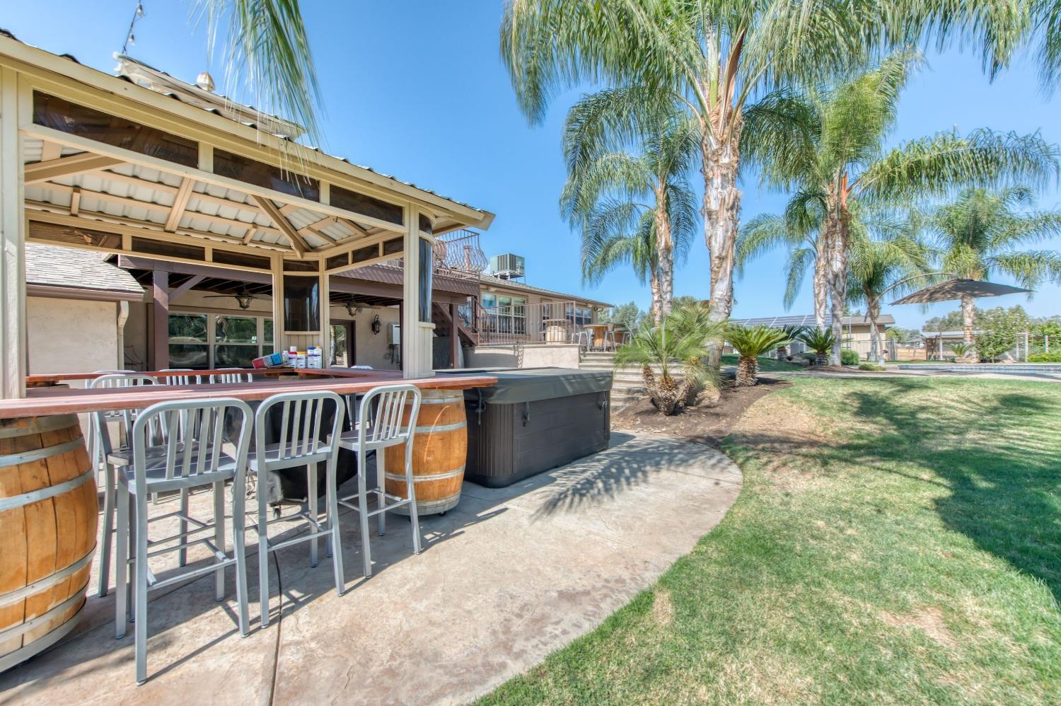 5588 North McCall Avenue Clovis, CA 93619 - Photo 52 of 77 a view of a chair and tables in the patio