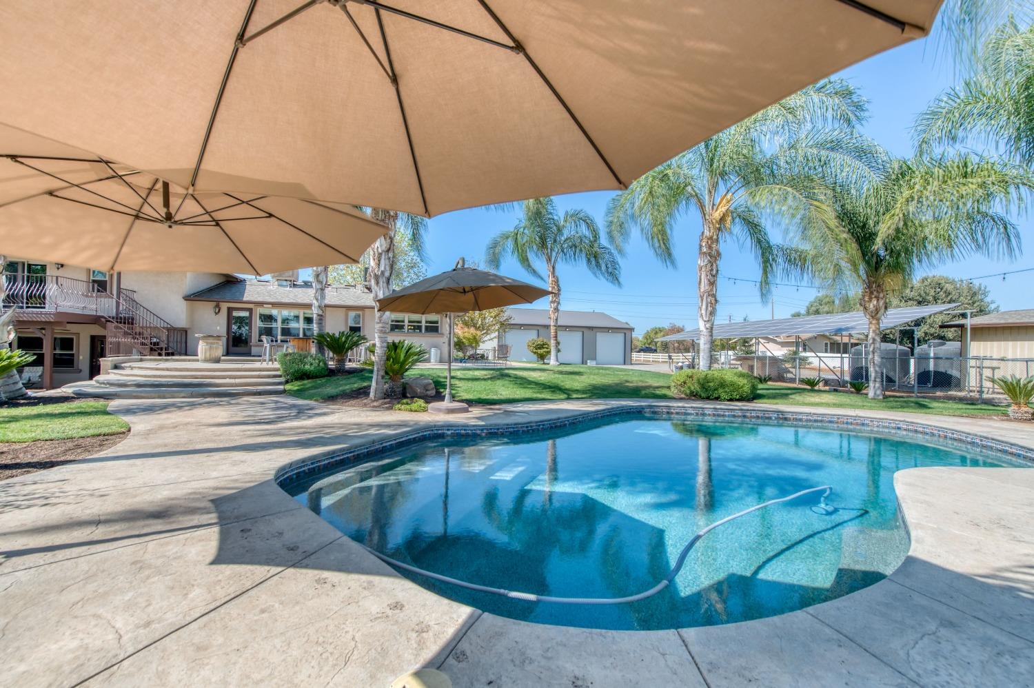 5588 North McCall Avenue Clovis, CA 93619 - Photo 54 of 77 a view of a house with swimming pool