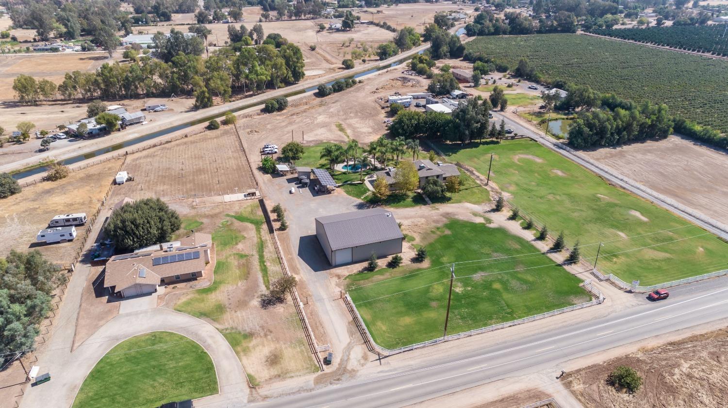 5588 North McCall Avenue Clovis, CA 93619 - Photo 60 of 77 an aerial view of a house with a garden and lake view