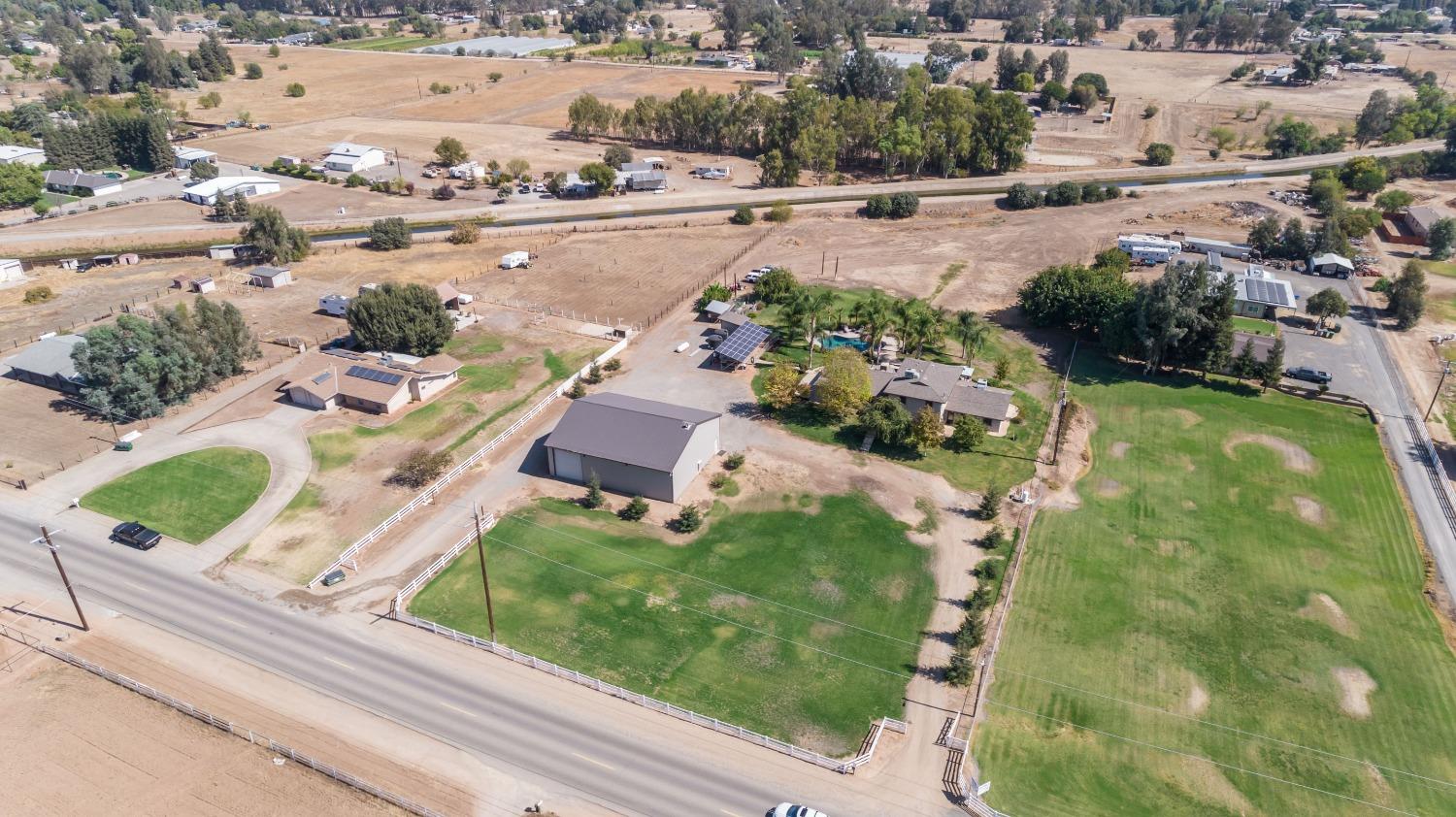 5588 North McCall Avenue Clovis, CA 93619 - Photo 62 of 77 an aerial view of a house with a yard basket ball court and outdoor seating