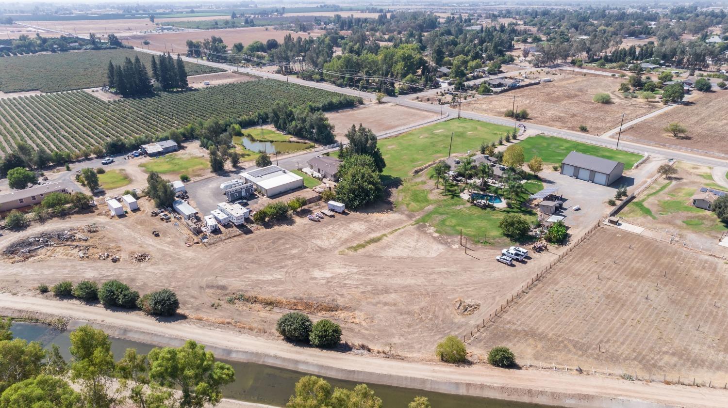 5588 North McCall Avenue Clovis, CA 93619 - Photo 63 of 77 an aerial view of a house with a yard and lake view