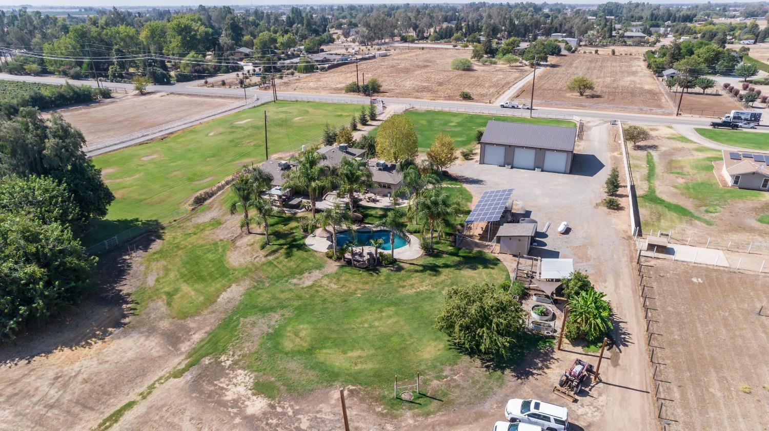 5588 North McCall Avenue Clovis, CA 93619 - Photo 70 of 77 an aerial view of a house with a yard basket ball court and outdoor seating