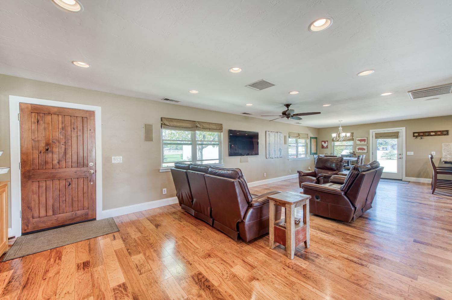 5588 North McCall Avenue Clovis, CA 93619 - Photo 10 of 77 a living room with furniture and wooden floor