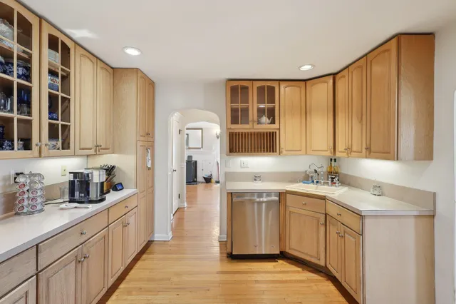 a kitchen with a sink cabinets and window