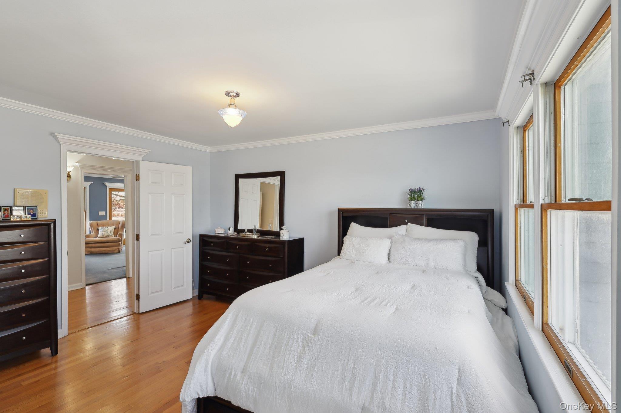230 West Islip Road West Islip, NY 11795 - Photo 23 of 50 Bedroom featuring ornamental molding and wood finished floors