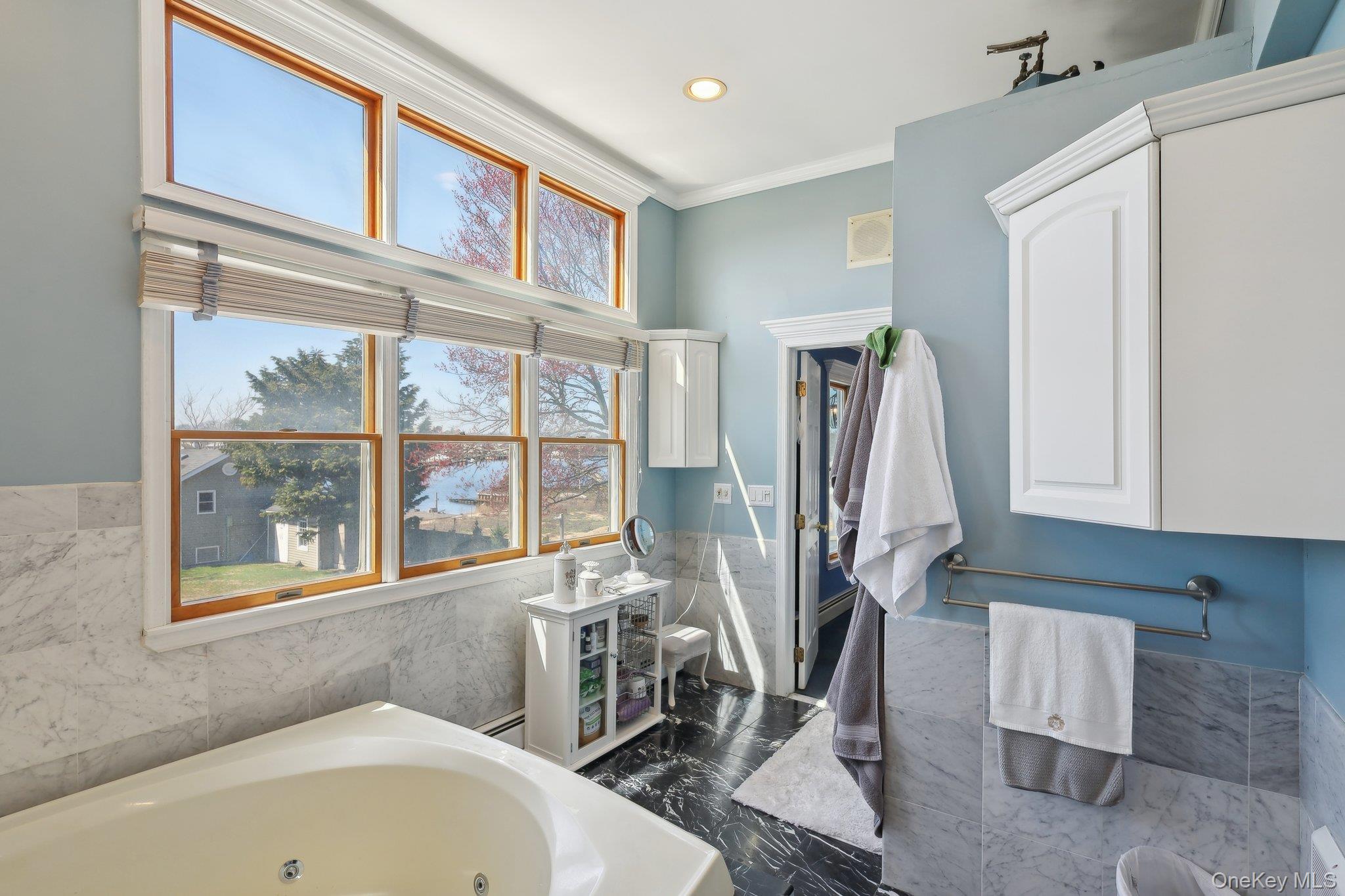 230 West Islip Road West Islip, NY 11795 - Photo 30 of 50 Full bathroom with recessed lighting, a baseboard radiator, crown molding, and a tub with jets