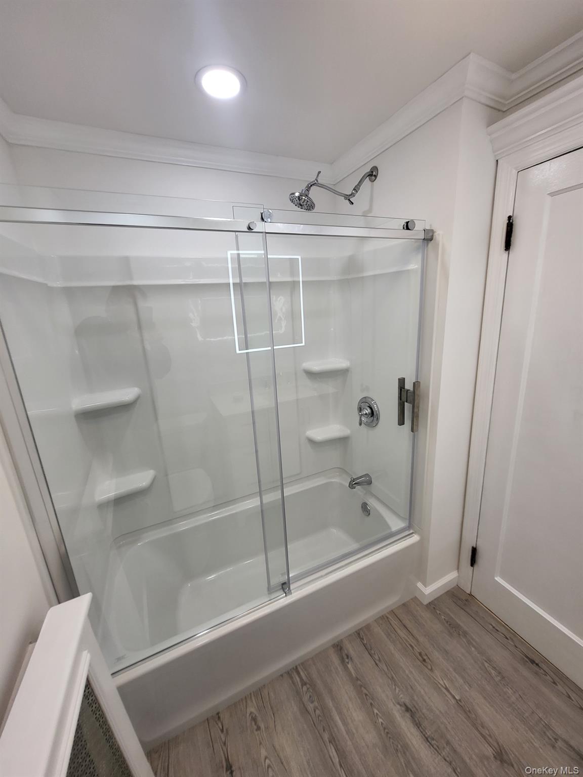 230 West Islip Road West Islip, NY 11795 - Photo 35 of 50 Full bathroom with wood finished floors, ornamental molding, shower / bath combination with glass door, baseboards, and recessed lighting
