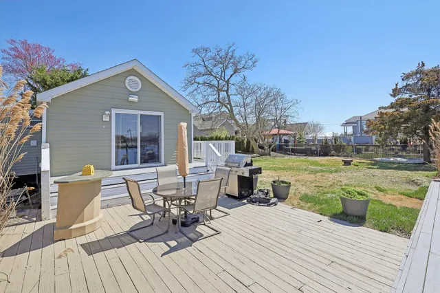 a view of a house with yard and sitting area