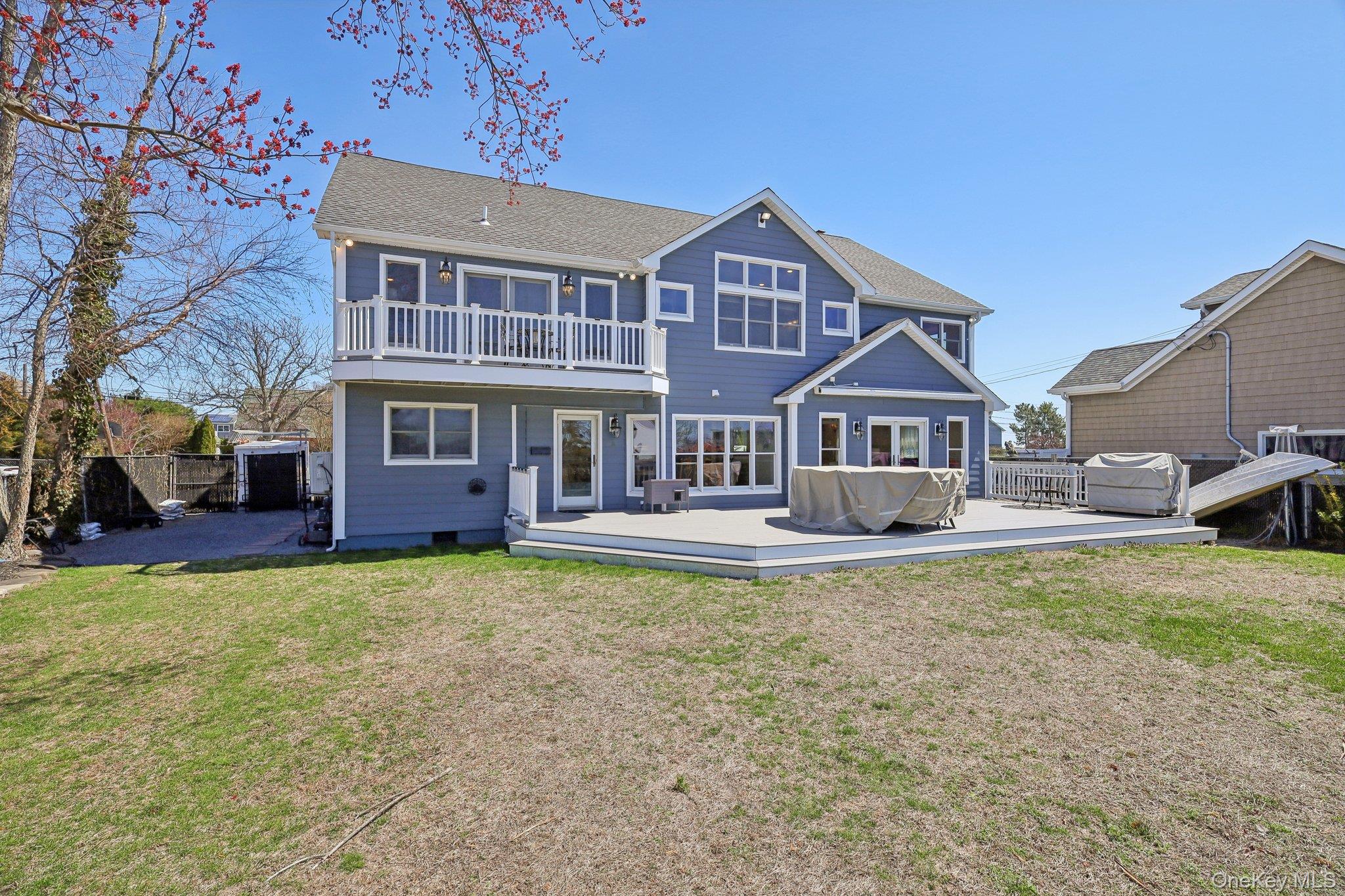 230 West Islip Road West Islip, NY 11795 - Photo 43 of 50 Rear view of property featuring a yard, fence, and a balcony