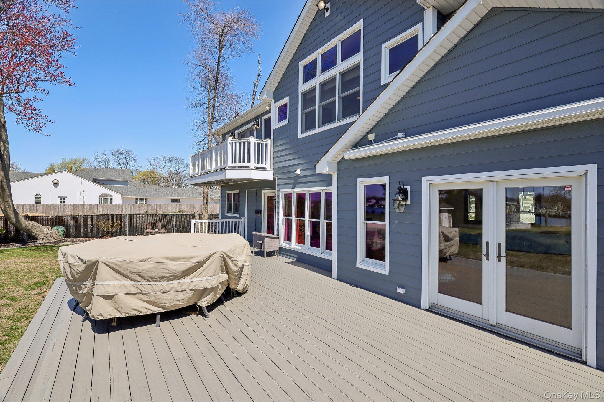 230 West Islip Road West Islip, NY 11795 - Photo 44 of 50 Wooden deck with french doors and fence