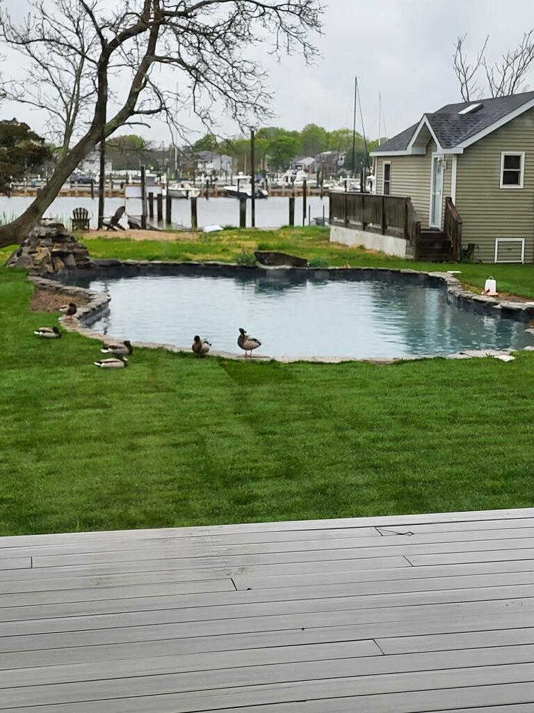 230 West Islip Road West Islip, NY 11795 - Photo 45 of 49 a view of building with river in front of it