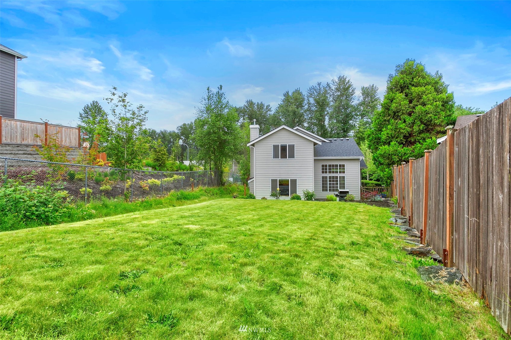 18487 Rainier View Road Southeast Monroe, WA 98272 - Photo 15 of 19 a front view of a house with garden