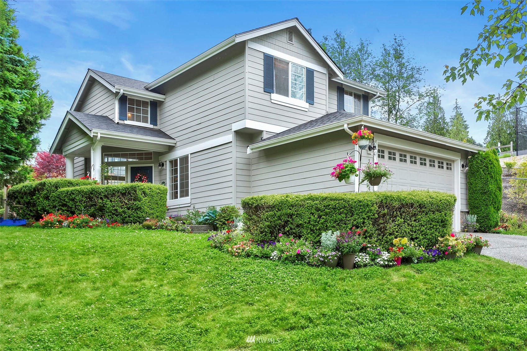 18487 Rainier View Road Southeast Monroe, WA 98272 - Photo 16 of 19 a front view of a house with a yard