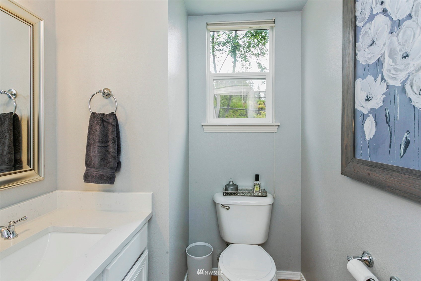 18487 Rainier View Road Southeast Monroe, WA 98272 - Photo 6 of 19 a bathroom with a toilet sink and mirror